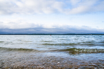 Landscape with waves near the lake shore