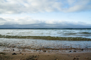 Landscape with waves near the lake shore