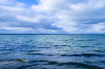 Landscape with waves near the lake shore