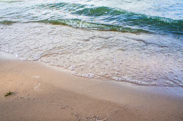 Transparent sea wave on a clean sandy seashoreа