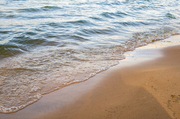 Transparent sea wave on a clean sandy seashoreа