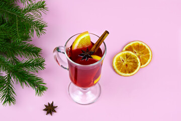 Mulled wine with slice of orange, cinnamon sticks and anise stars, winter drink