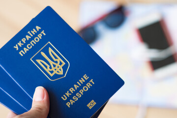 three ukrainian passports on the map, travel concept, travel to holiday, trip to europe
