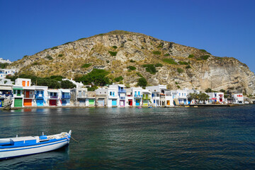 Fishing village seen from the water in Milos, Greece