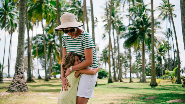 Stock photo of young lovely girl hugging her mom.
