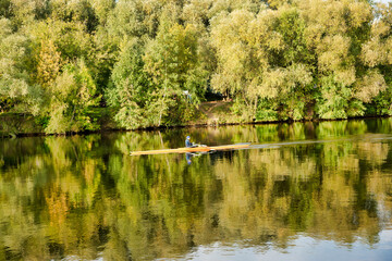 Sportsman kayaking on the river. Autumn landscape. Moscow river in Strogino, Moscow