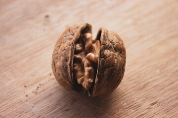 Cracked Walnut on the wooden table