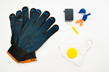 industrial ear plugs, respirator, work gloves on a white background. View from above.