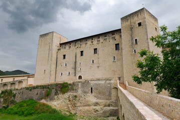 Fototapeta na wymiar Walls and tower of medieval La Rocca Papal fortress in Spoleto Italy