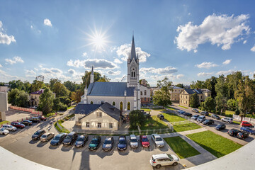  parking lot  with cars near german church in sunny day