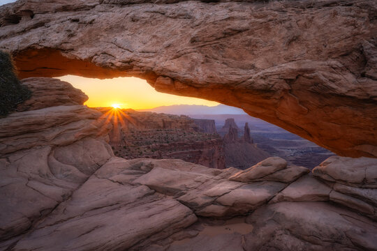 Sunburst At The Horizon From Mesa Arch In Moab Utah