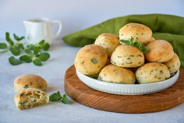 Homemade buns with fresh zaatar, oregano leaves