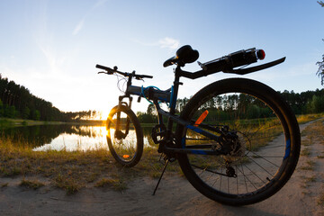 Fototapeta premium Bicycle silhouette on nature side