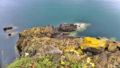 Seascape along the Bray to Greystones Cliff Walk. Long-exposure shot of coastal line in Bray, Co. Wicklow, Ireland 