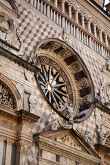 The Cappella Colleoni is a church & mausoleum in Bergamo, Lombardy, Northern Italy, dedicated to the saints of the Baptism religion. Close up view of the marble facade of the medieval cathedral.