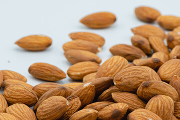 Almond nuts isolated on white background, Selective focus. Is a healthy food Rich in vitamins Fiber and Antioxidants.