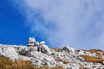 Fototapeta premium small cairn marks the path through the mountain pass