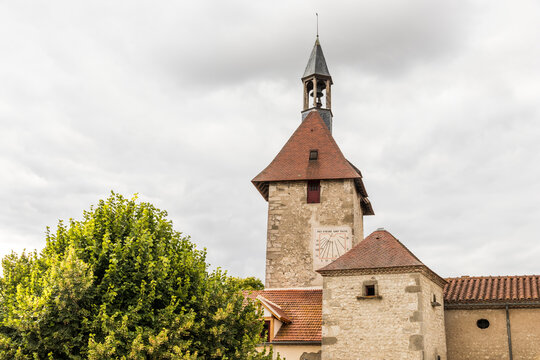 Charroux, France. Half-timbered house and church tower in one of the most beautiful villages in the Allier department in Auvergne