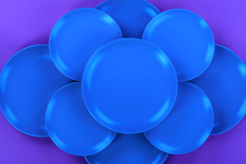 blue kitchen ceramic plates isolated on abstract blue background