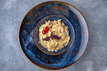 Pasta with ham. Natural delicious food. Greek cuisine menu. Still life in a marine style on a blue background.