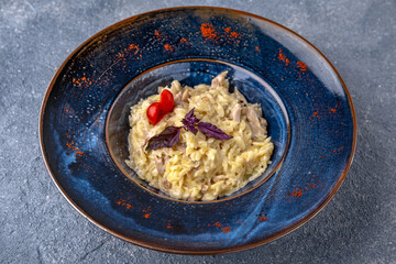 Pasta with ham. Natural delicious food. Greek cuisine menu. Still life in a marine style on a blue background.