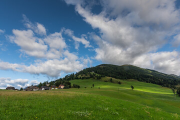 green hills and clouds while hiking