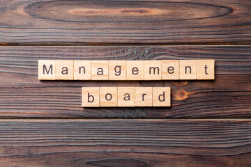 Management board word written on wood block. Management board text on cement table for your desing, concept