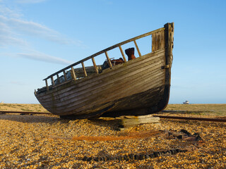 Wreckage of an old boat on the beach at Dungeness in Kent