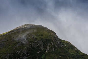 Fototapeta na wymiar rock round peak while hiking in the mountains