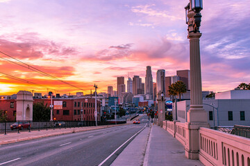 Los Angeles downtown skyline on street with sunset.