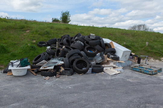 Rubbish dumped in a car park at a beauty spot. Fly tipping
