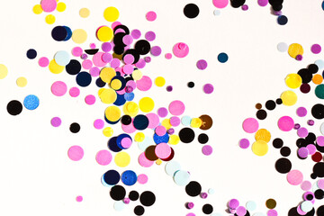 Many multicolored metallic circles forming a texture for the background.