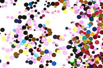 Many multicolored metallic circles forming a texture for the background.