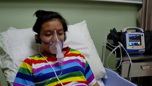 Girl sick admit in hospital making inhalation with nebulizer Allergy