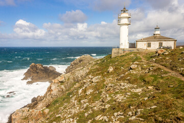 Fototapeta na wymiar Muxia, Spain, The lighthouse of Cabo Tourinan in Galicia, the most westerly point of Peninsular Spain