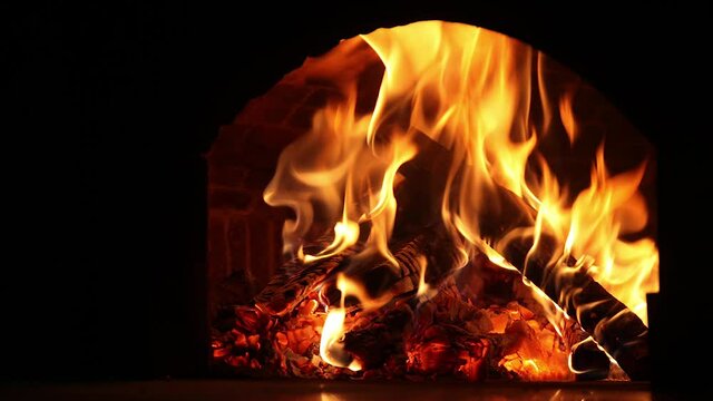 The fire burns in the oven. Pizza oven. tim lapse burning bonfire. Pizza oven. Fire flares up. Bonfire is on fire. Burning firewood.
