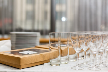 Set of empty wine glasses in a row, white background. Party in a restaurant