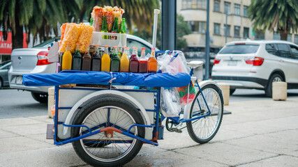 Mexican Cargo Bike Full of Fried Snacks and Slush Syrup Bottles in the Streets of Mexico City
