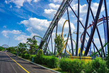 Roller coaster against a cloudy sunset sky