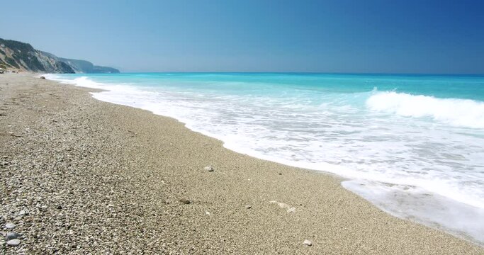 Kathisma Beach, Lefkada Island, Greece. Beautiful waves and blue sea. Summer vacation concept