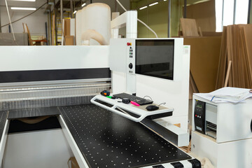 Elements of modern equipment, a machine with a computer installation, a saw for working with wood
