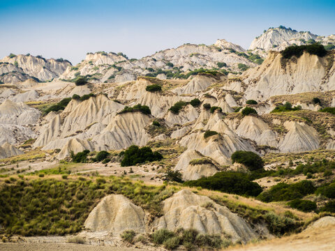 Dramatic view of Aliano badlands (calanchi), lunar landscape made of clay sculptures eroded by the rainwater, Basilicata region, southern Italy
