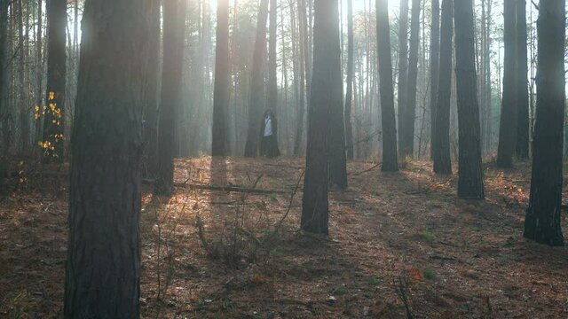  Wanderer in Black Cloak Cowl Walks Through Misty Forest. Wandering Monk Pilgrim. Autumn Morning. Mysterious Traveler. 2x Slow motion 60 fps 4K