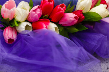 Pink, white, red tulip flower. Bouquet of flowers ready for arrangpemt. Nasis for greeting card with spring flowers
