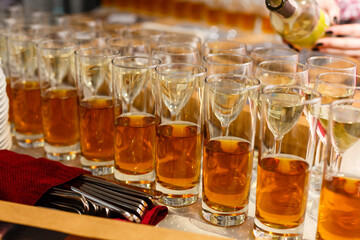 Restaurant serving, glasses with wine and juice in a row