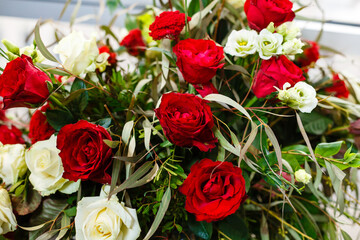 Red and white roses, luxury bouquet on a white background, top view