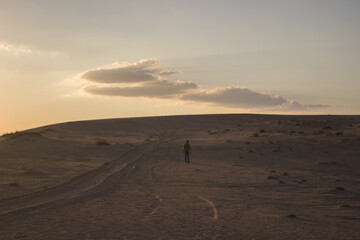 Fototapeta na wymiar a man siluette on desert