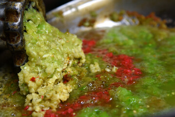 twisted vegetables of yellow, red, green color in a saucepan