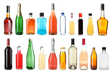Set of bottles with different liquids on white background