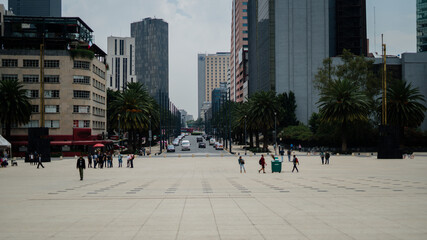 Tourists Walking Around the República Square with Modern Buildings in the Background